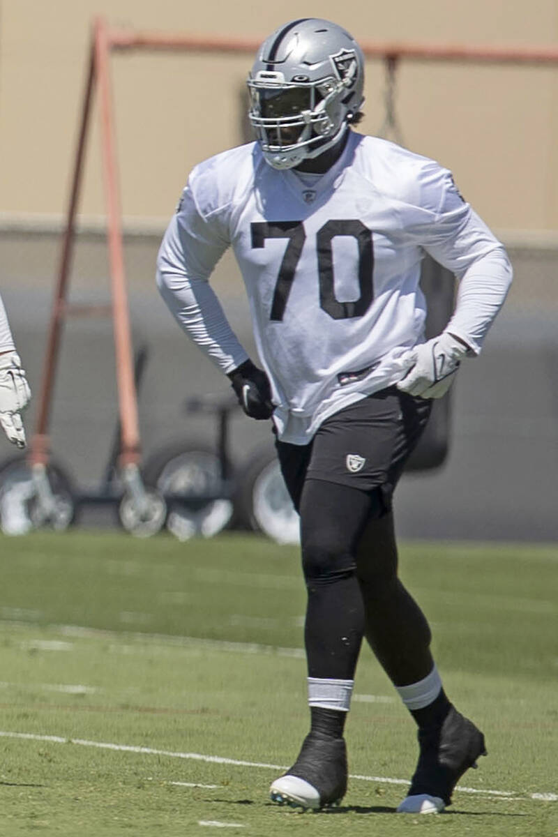 Raiders offensive tackle Alex Leatherwood (70) runs during a team practice on Thursday, June 2, ...