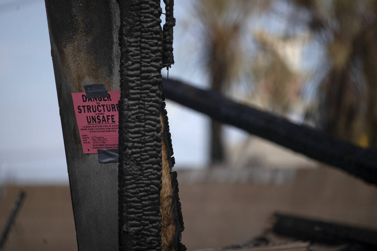 Burned remnants of Urban Lofts Townhomes are marked unsafe on Wednesday, June 29, 2022, in down ...