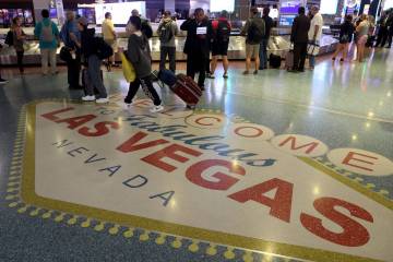 Passengers are seen in baggage claim in Terminal 1 at Harry Reid International Airport in June ...