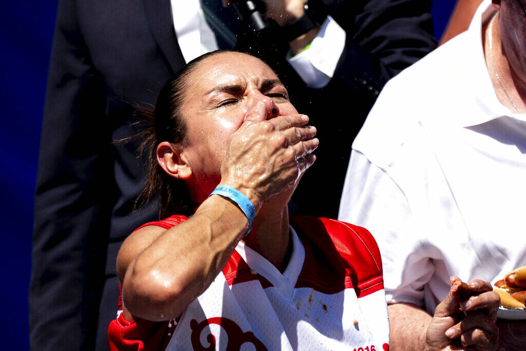 Michelle Lesco competes in the Nathan's Famous Fourth of July hot dog eating contest in Coney I ...