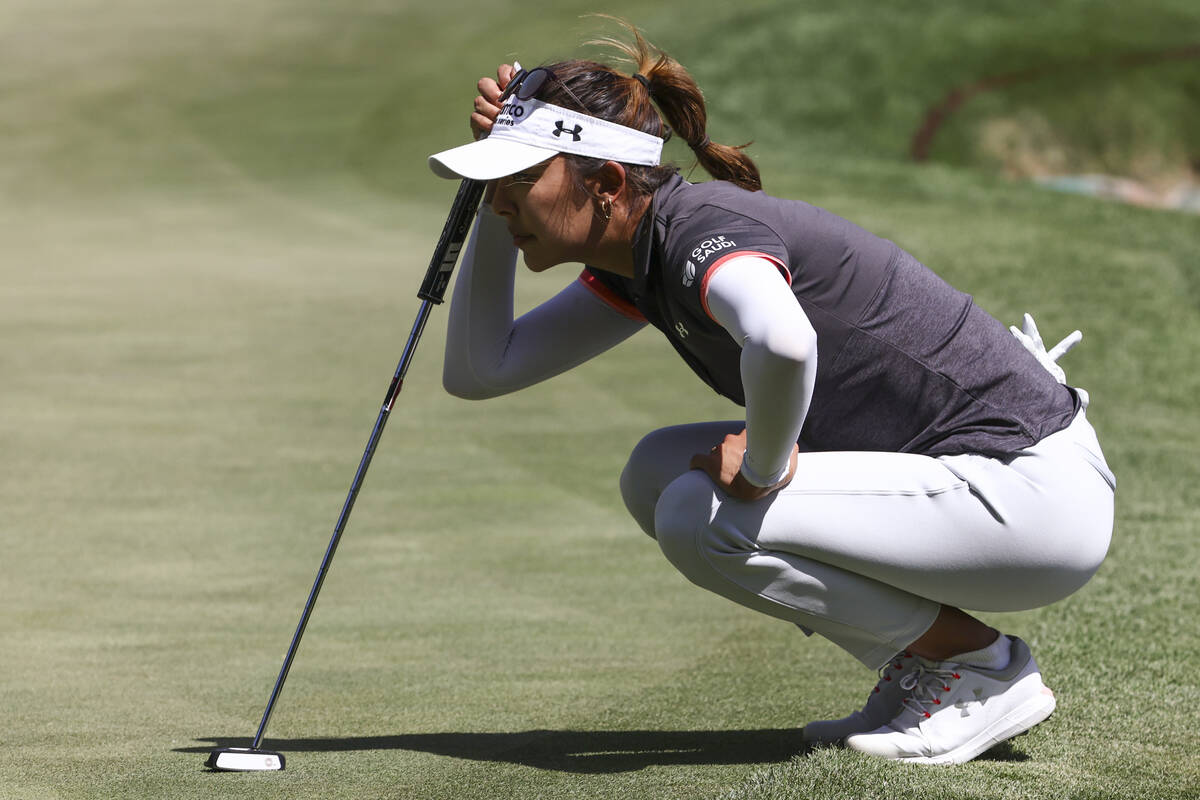 Alison Lee lines up her putt shot on the ninth hole during the second day of round-robin in the ...