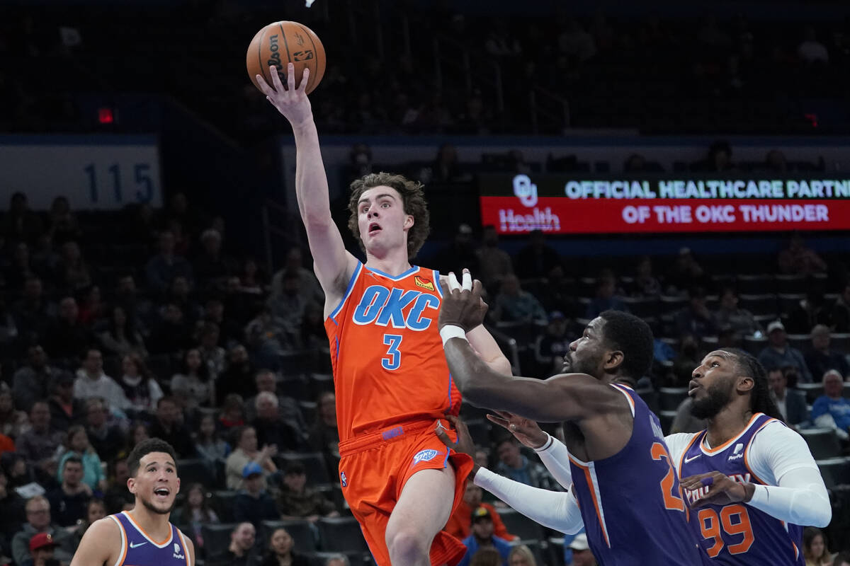 Oklahoma City Thunder guard Josh Giddey (3) shoots in front of Phoenix Suns center Deandre Ayto ...