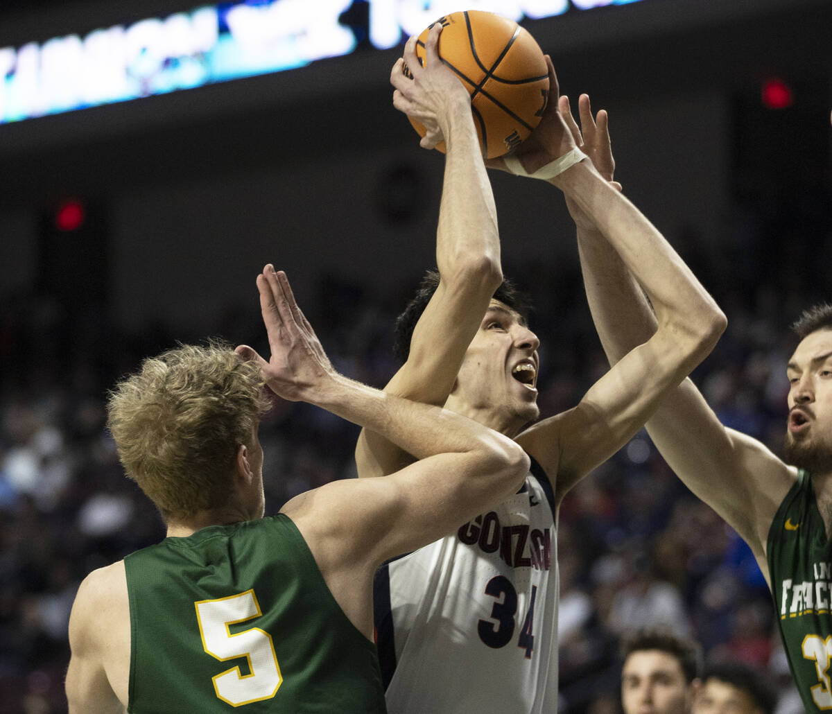 Gonzaga Bulldogs center Chet Holmgren (34) drives past San Francisco Dons forward Isaiah Hawtho ...