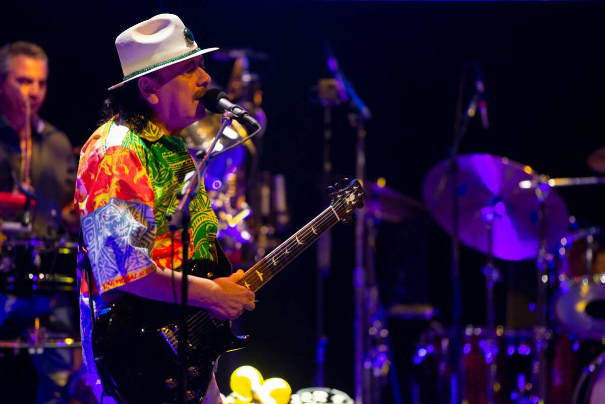 Carlos Santana performs a sound check after a press conference to announce an extension of Sant ...