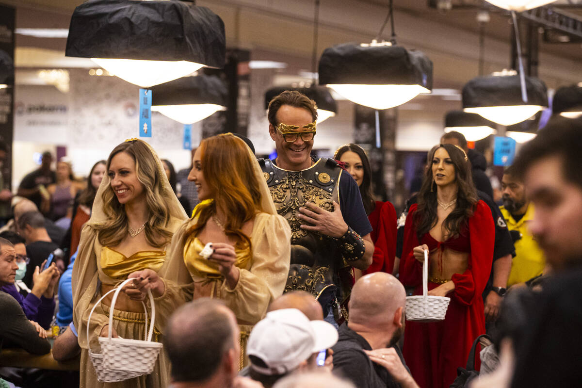 Actor and World Series of Poker master of ceremonies Vince Vaughn walks by tables during the WS ...