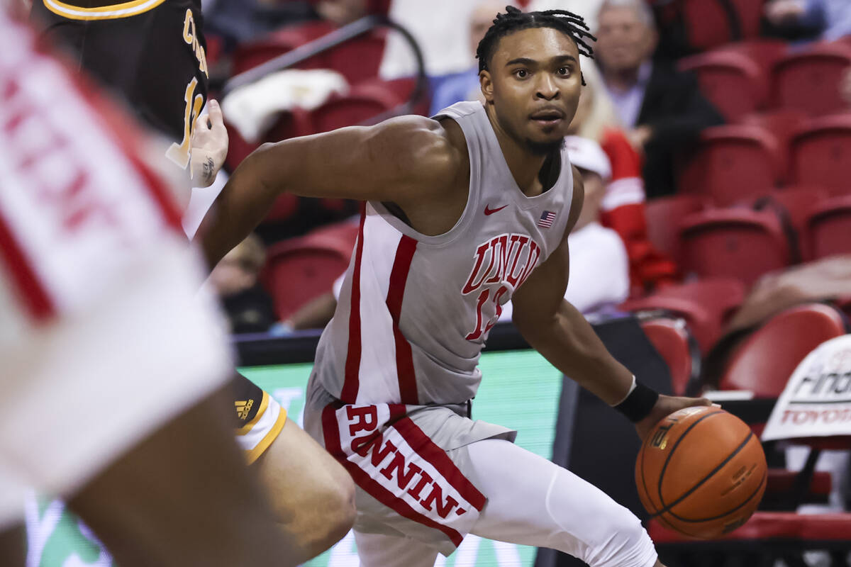 UNLV Rebels guard Bryce Hamilton (13) drives to the basket against the Wyoming Cowboys during t ...