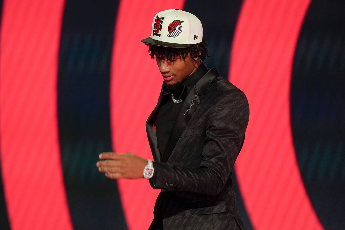 Shaedon Sharpe walks across the stage after being selected seventh overall by the Portland Trai ...