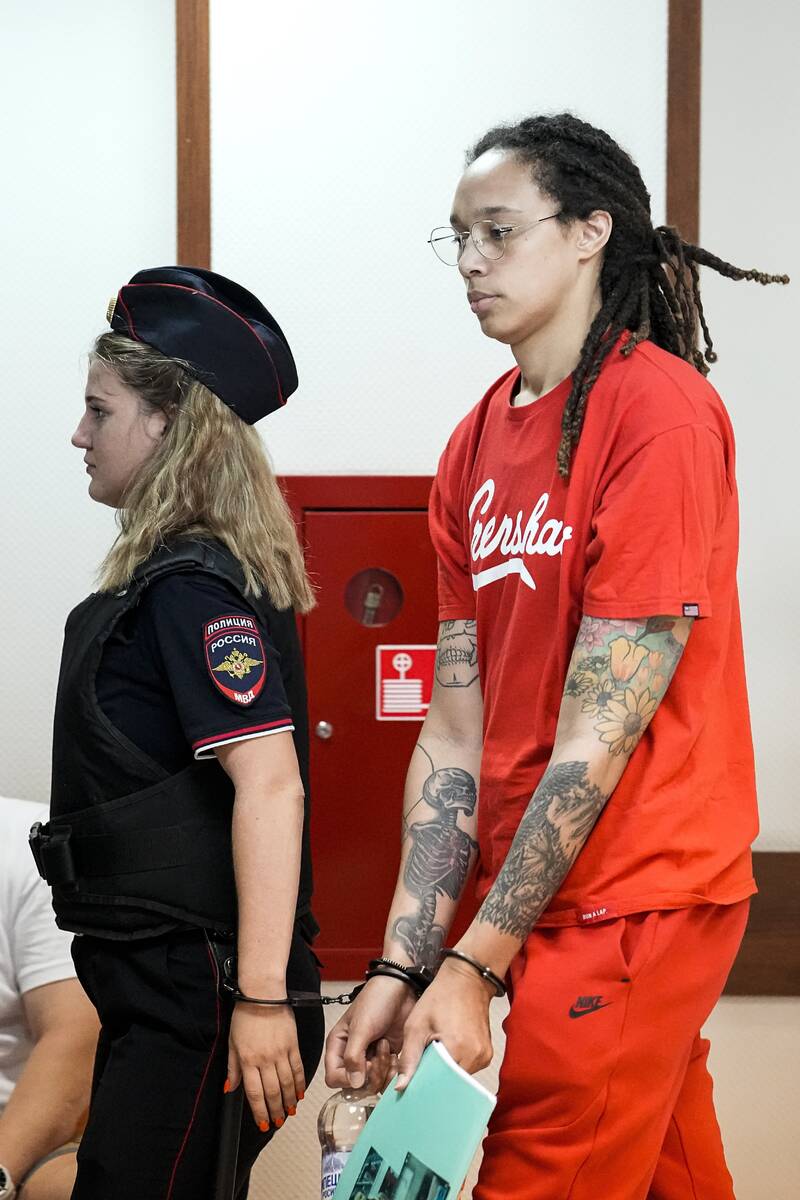 WNBA star and two-time Olympic gold medalist Brittney Griner is escorted to a courtroom for a h ...