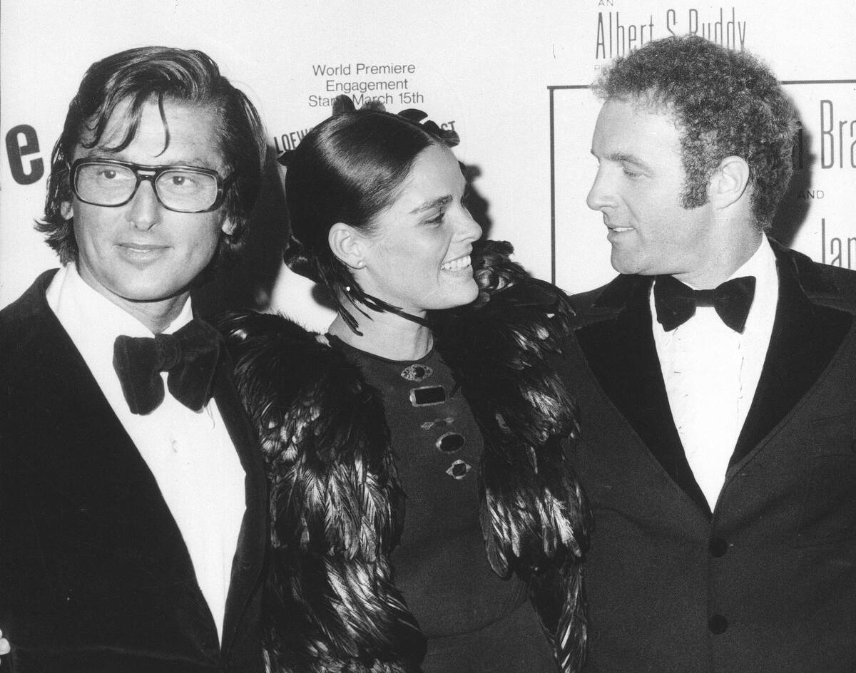 FILE - Paramount Pictures vice president Robert Evans, left, his wife, actress Ali MacGraw, and ...
