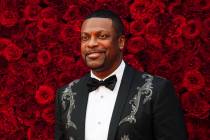 Chris Tucker poses for a photo on the red carpet at the grand opening of Tyler Perry Studios on ...