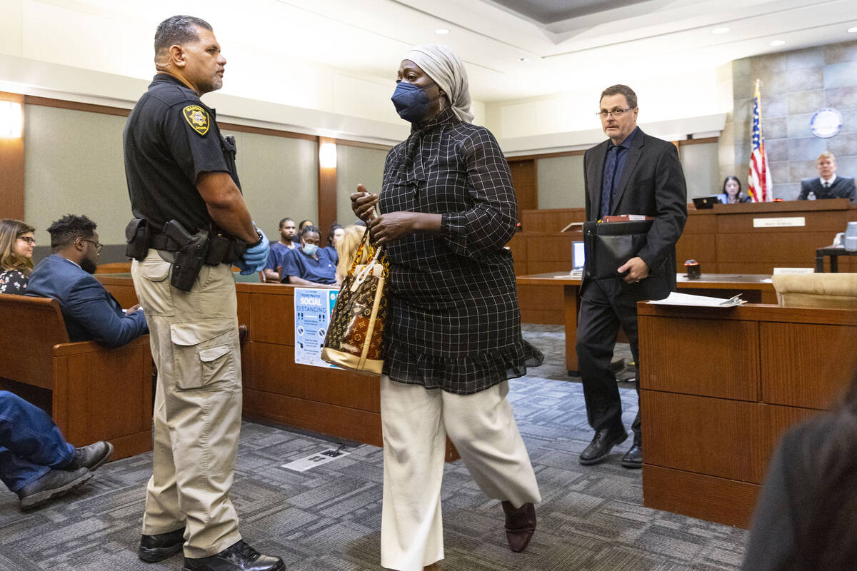 Beverly Senior, center, who is accused of operating an unlicensed group home and is facing mult ...