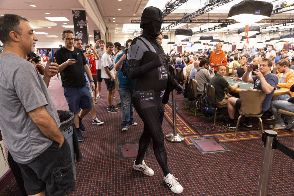 Phil Hellmuth makes his grand entrance to the World Series of Poker tournament dressed in a Dar ...