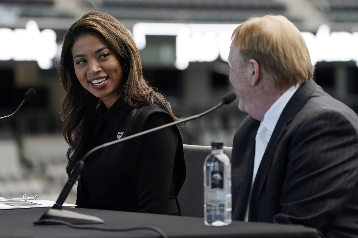 Sandra Douglass Morgan, left, speaks beside Las Vegas Raiders owner Mark Davis during a news co ...