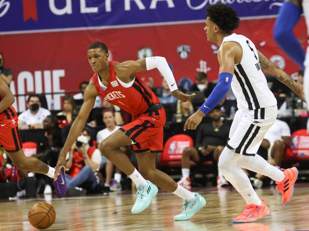 Houston Rockets' Jabari Smith (1) brings the ball up court against Orlando Magic's Paolo Banche ...