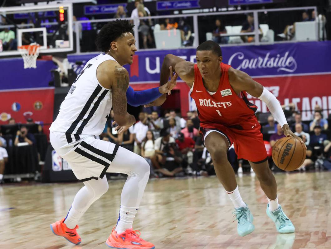 Houston Rockets' Jabari Smith (1) drives to the basket against Orlando Magic's Paolo Banchero d ...