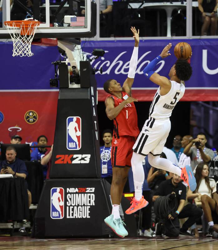 Orlando Magic's Paolo Banchero (5) shoots over Houston Rockets' Jabari Smith (1) during the fir ...