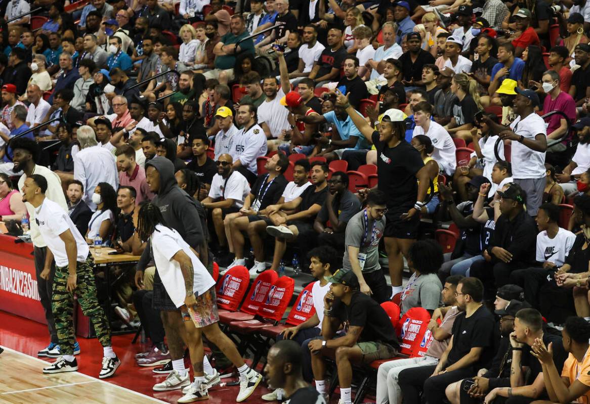 People react after a play between the Houston Rockets and Orlando Magic during the second half ...