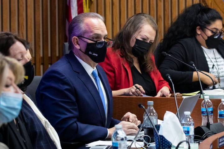 Clark County School District Board of Trustees President Linda Cavazos, second right, and Super ...