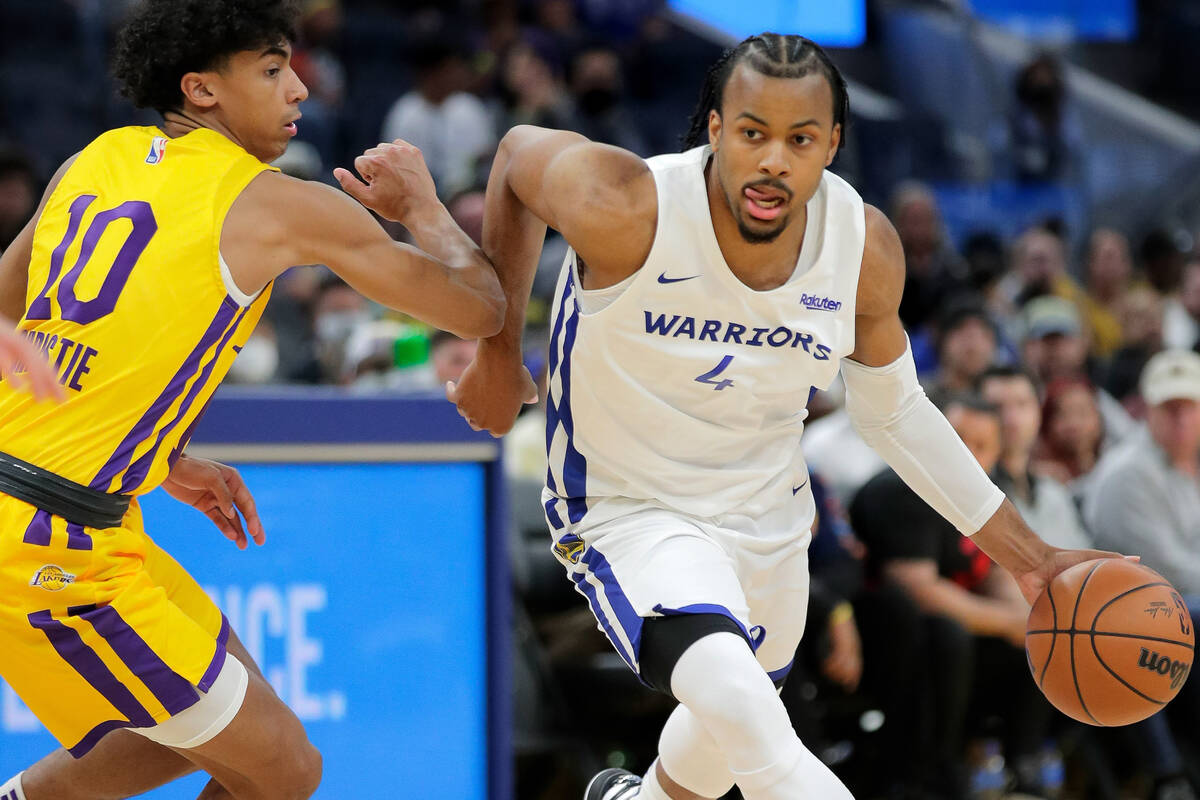 Moses Moody (4) drives up court in the first half as the Golden State Warriors played the Los A ...