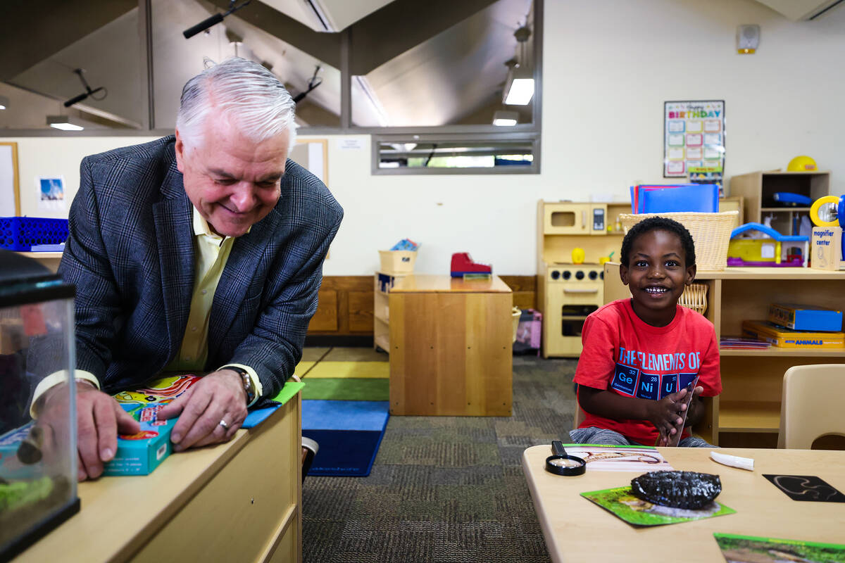 Gov. Steve Sisolak hangs out with Robert Lamoth-Nix, 5, at the College of Southern Nevada&#x201 ...