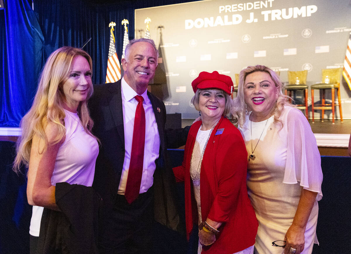 Clark County Sheriff Joe Lombardo and his wife Donna, left, pose for a photo with Marileide Ave ...