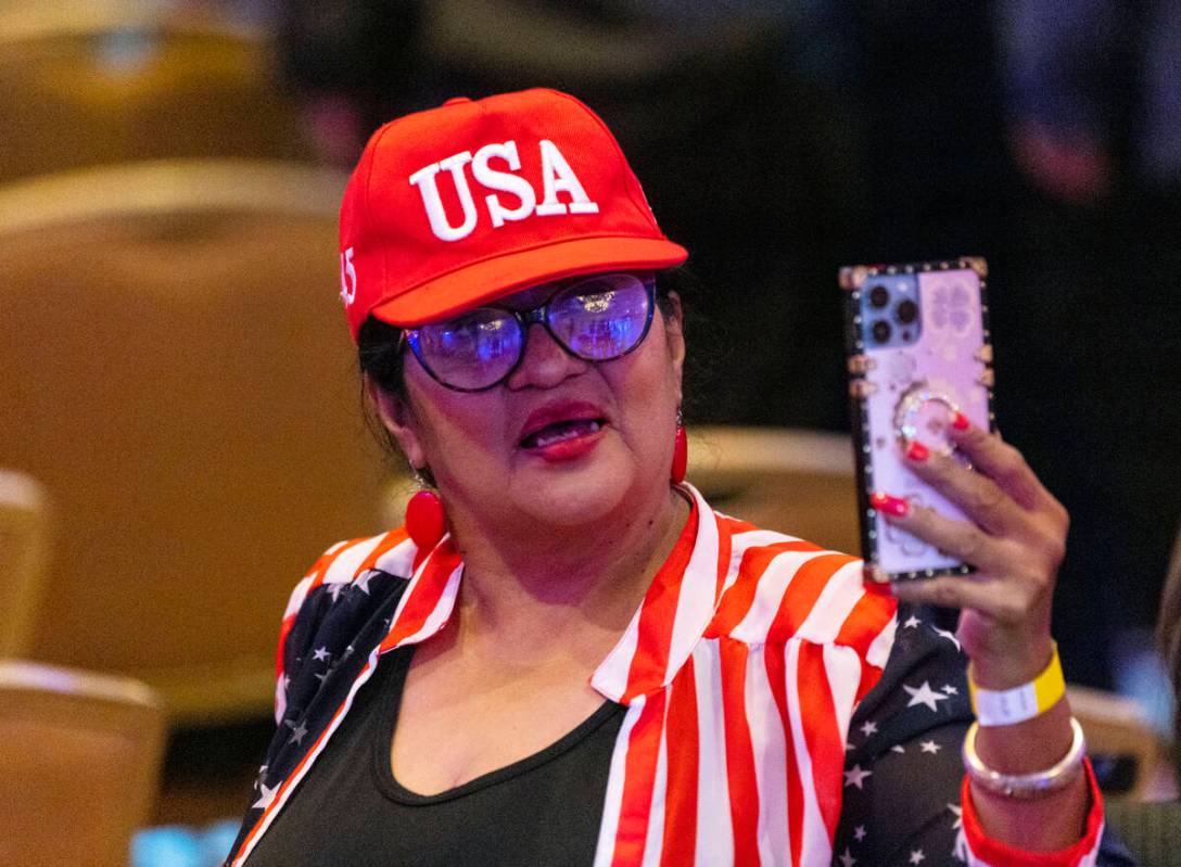 Rosemary Flores, a Hispanic community activist, takes a selfie during the Republican Party camp ...