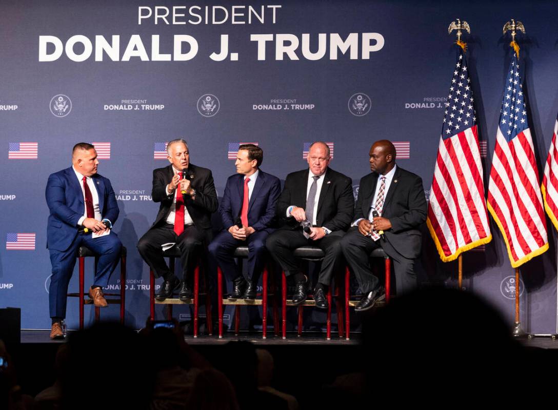 Clark County Sheriff Joe Lombardo, second left, speaks as former Nevada Attorney General Adam L ...