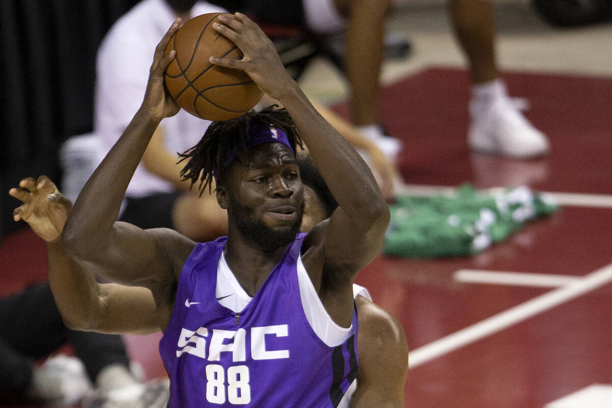 Sacramento Kings center Neemias Queta (88) looks to pass while guarded by Boston Celtics forwar ...