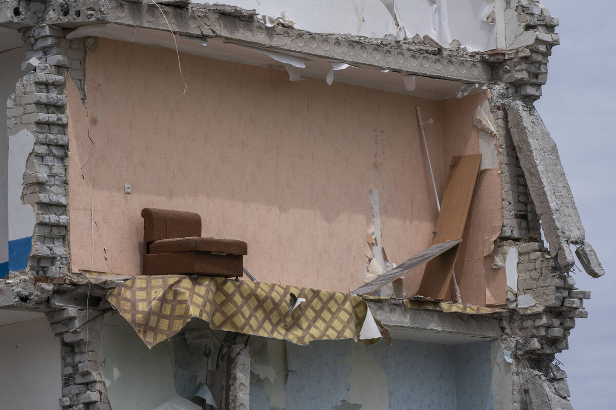 A sofa chair is seen in what is left standing in the aftermath of a Russian rocket that hit an ...