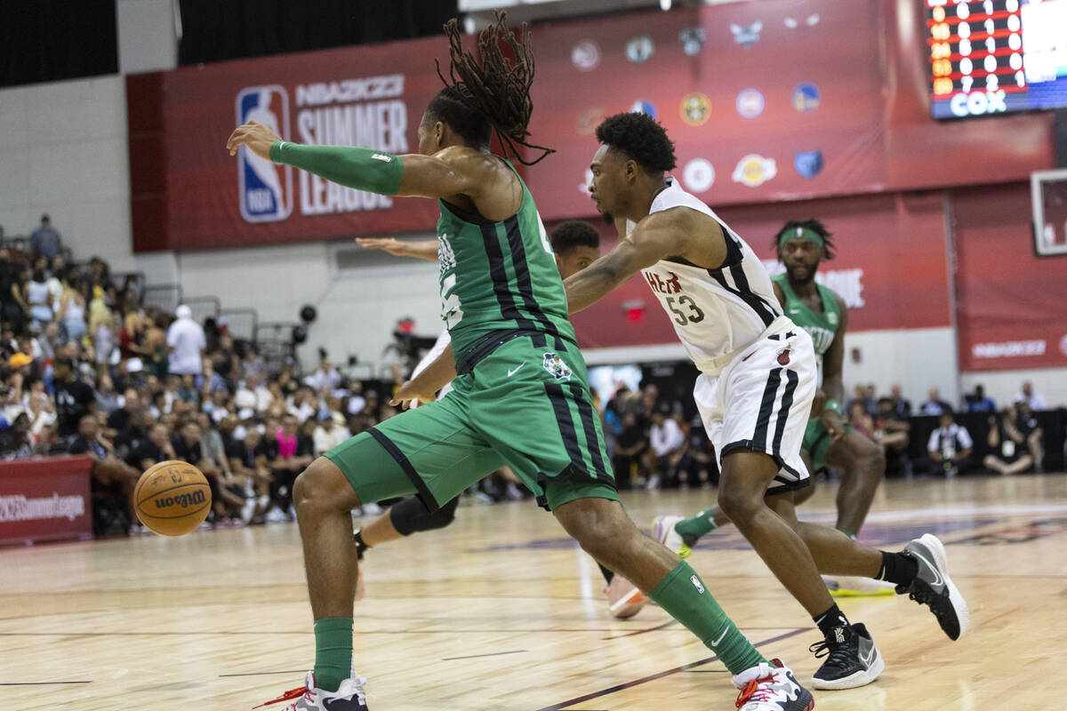 Miami Heat's Bryce Hamilton (53) defends against Boston Celtics' Juhann Begarin (45) in the fir ...