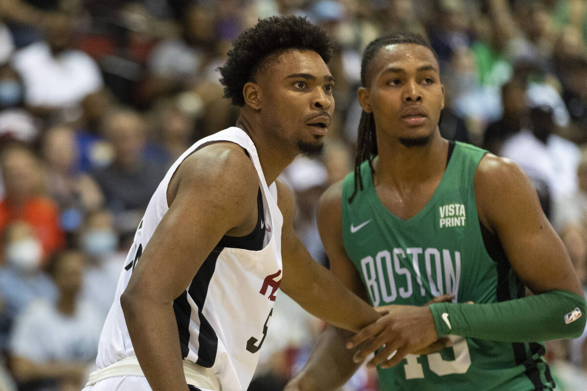 Miami Heat's Bryce Hamilton (53) defends against Boston Celtics' Juhann Begarin (45) in the fir ...