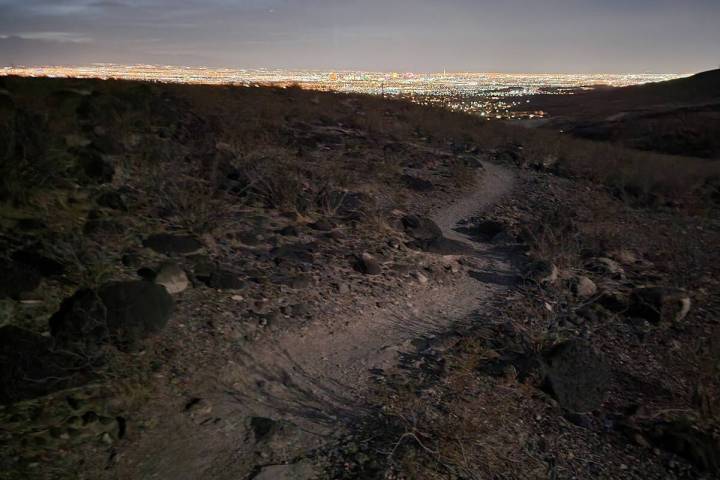 A path winds along numbered routes connected to the Shadow Canyon trailhead in Sloan Canyon Nat ...