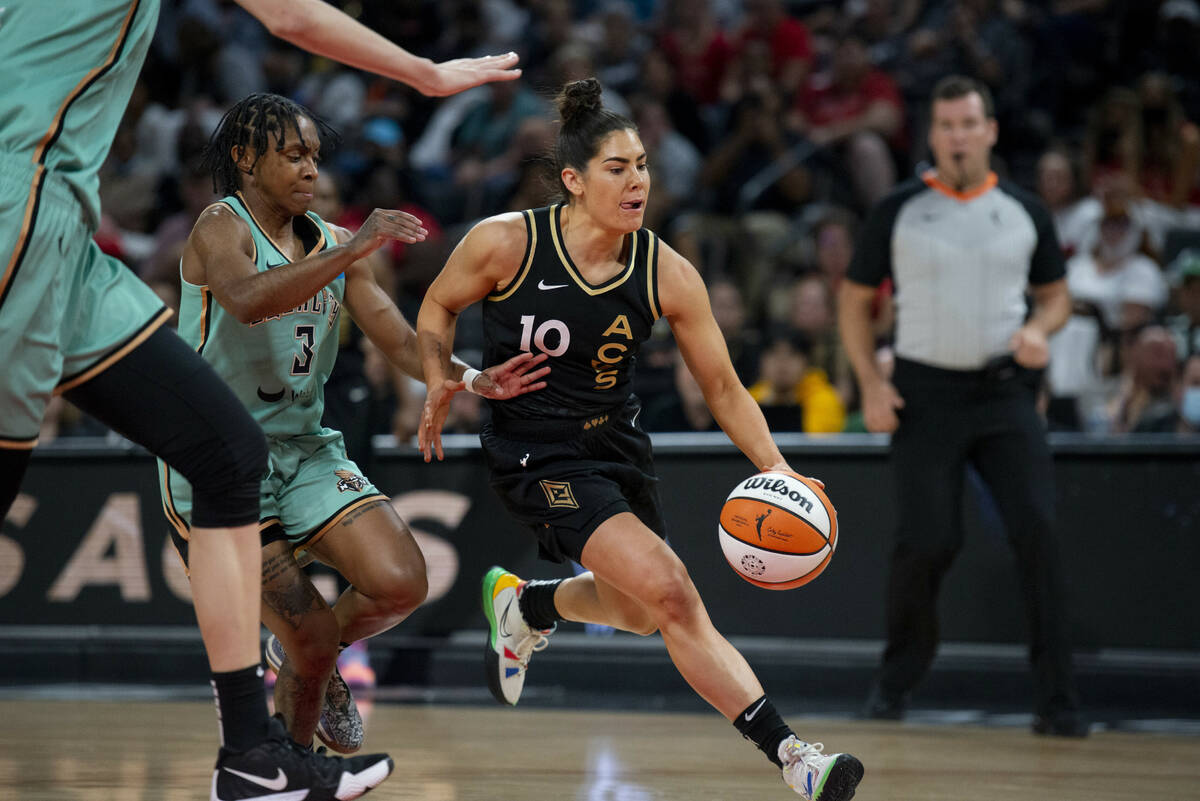 Las Vegas Aces guard Kelsey Plum (10) drives past the New York Liberty defense during the game ...