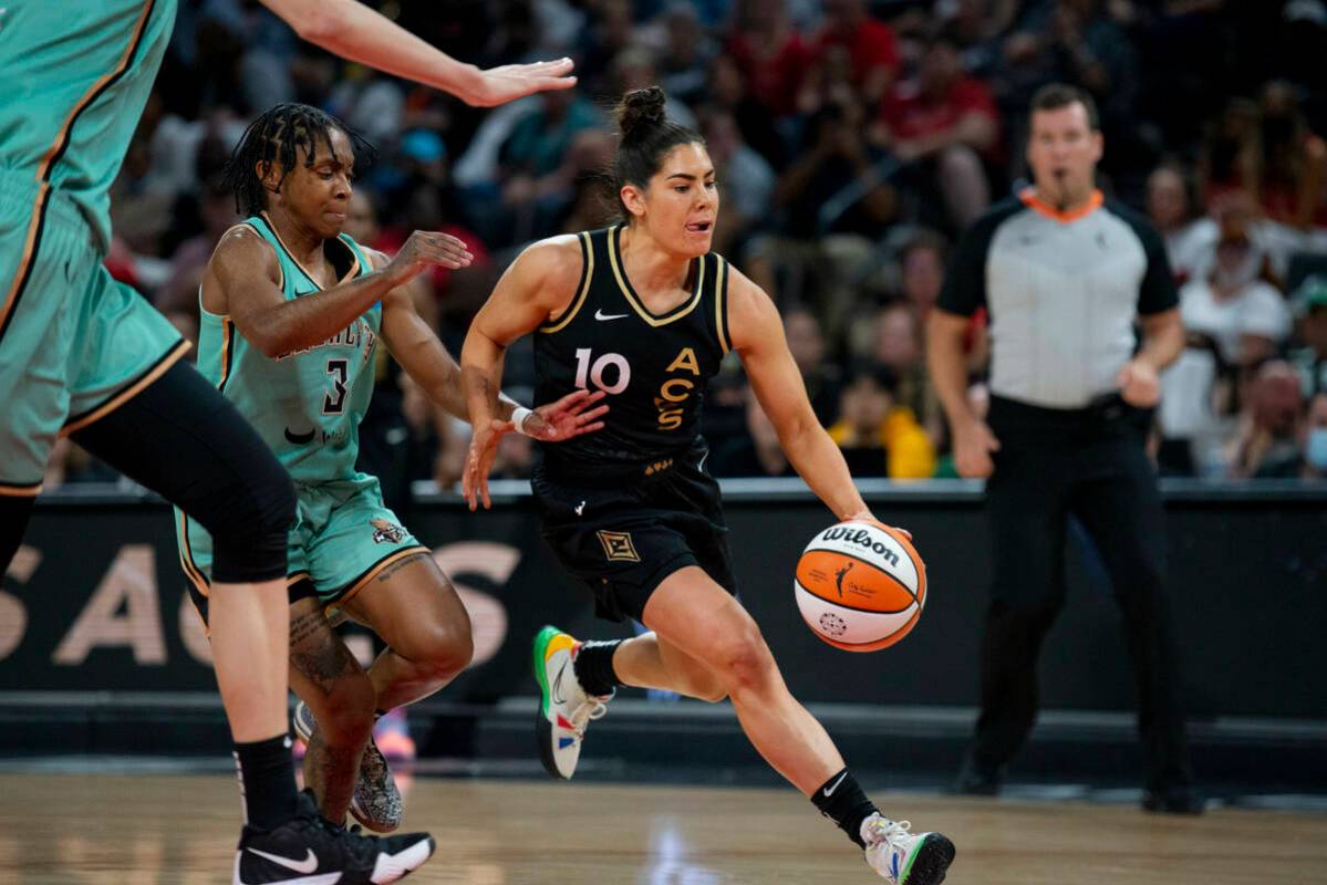 Las Vegas Aces guard Kelsey Plum (10) drives past the New York Liberty defense during the game ...