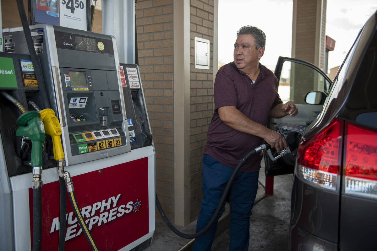 Enrique Zafra pumps gas at a Murphy Express on Craig Road on Tuesday, July 12, 2022, in Las Veg ...