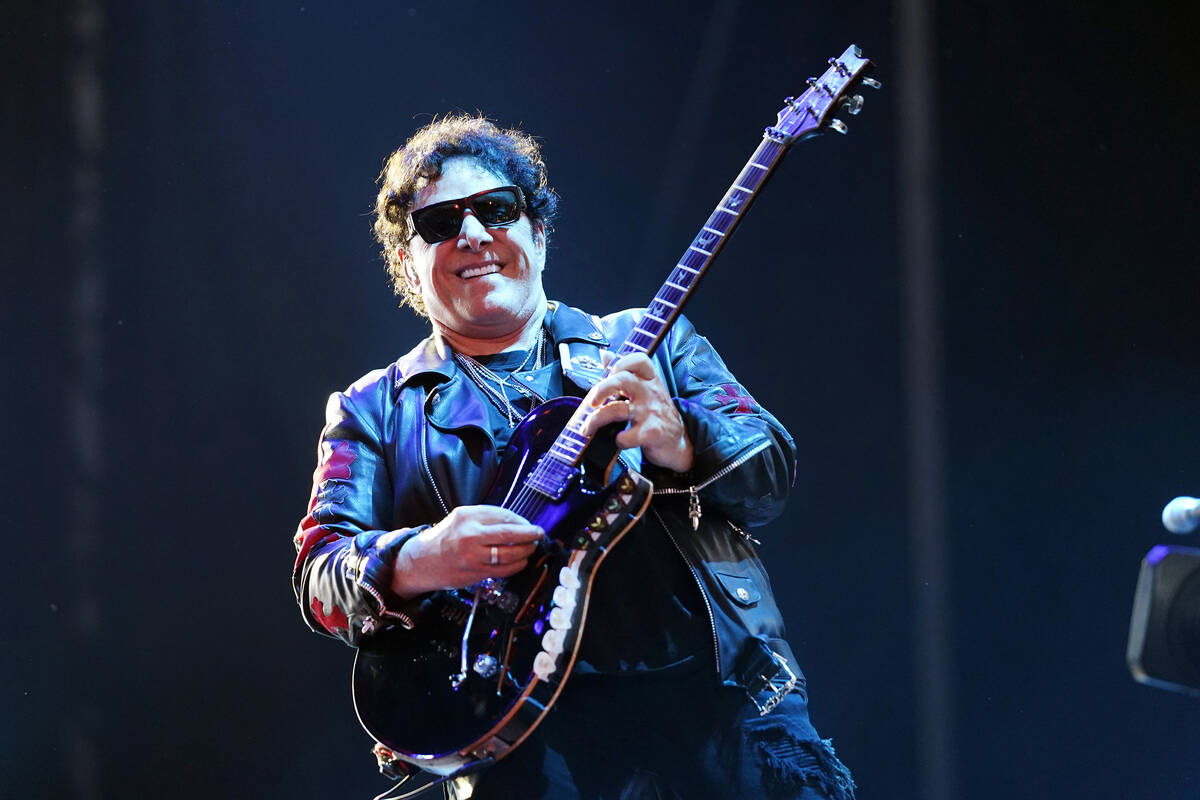 Neal Schon of the band Journey performs on day three of the Lollapalooza music festival on Satu ...