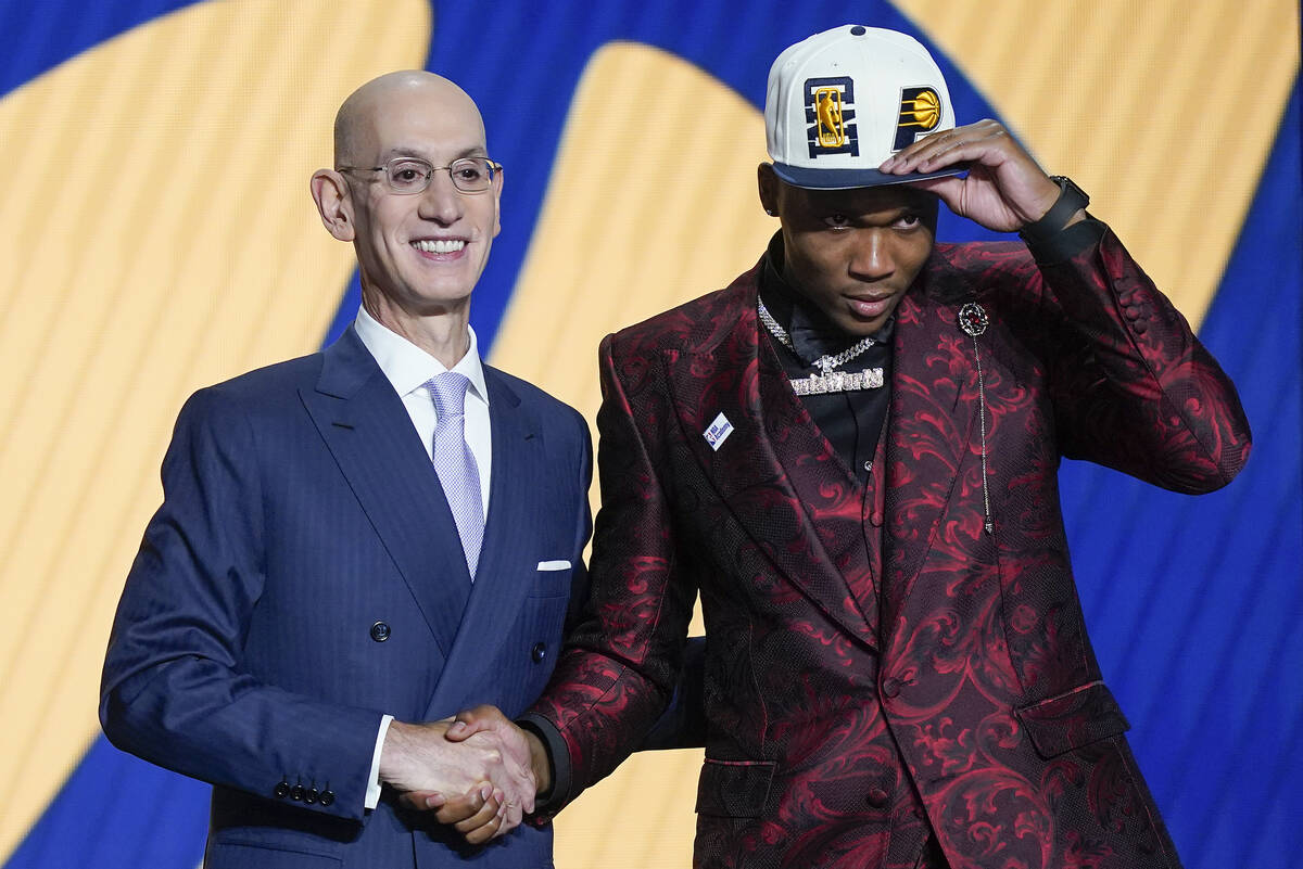 Bennedict Mathurin poses for a photo with NBA Commissioner Adam Silver after being selected six ...