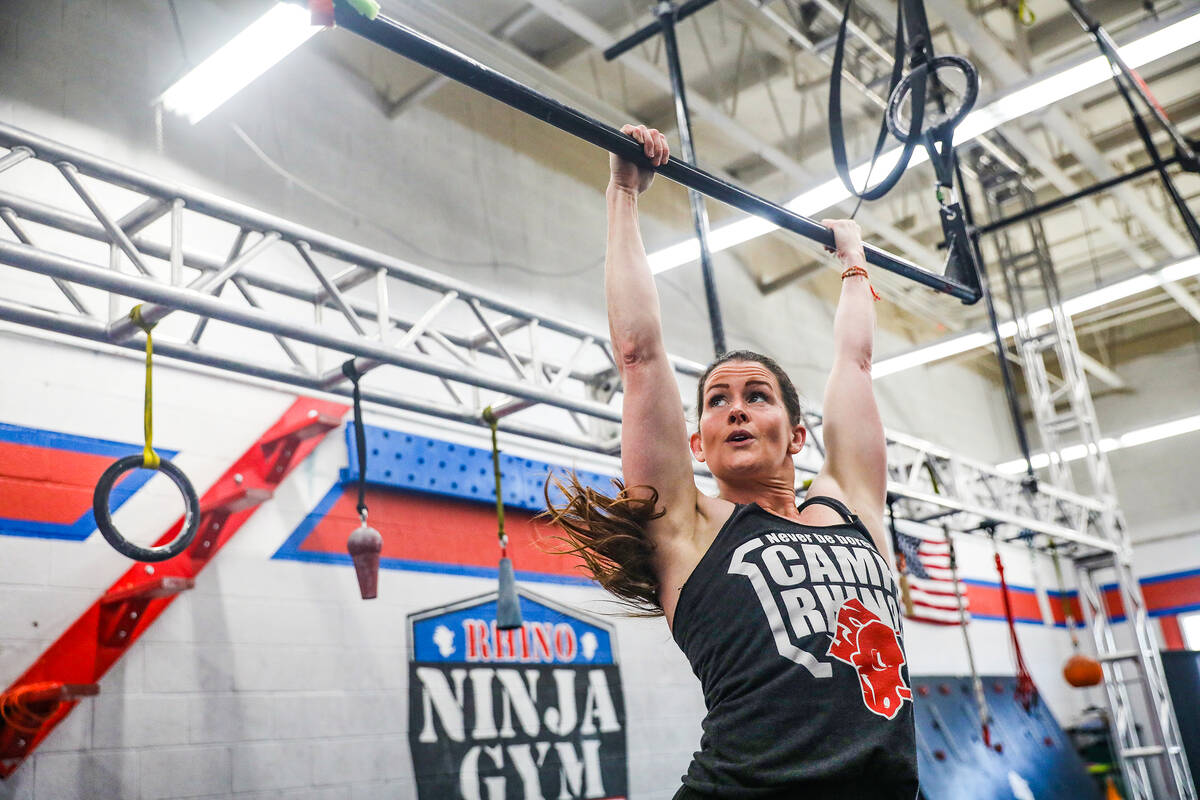 Owner Julie Johnston swings in an obstacle course at Rhino Ninja Gym in Las Vegas, Sunday, July ...