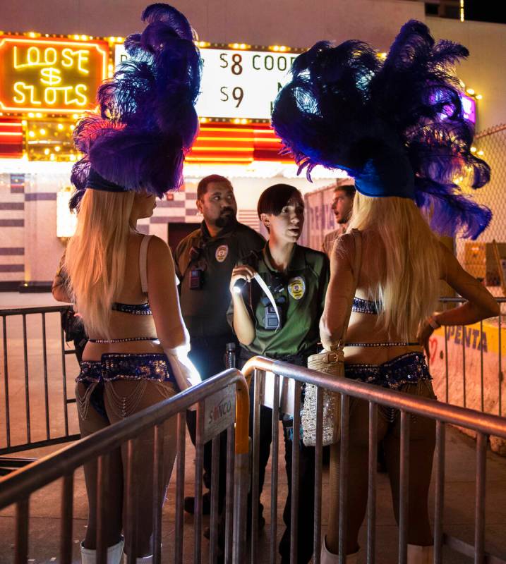 Buskers are screened before entering the Fremont Street Experience on Saturday, July 9, 2022, i ...