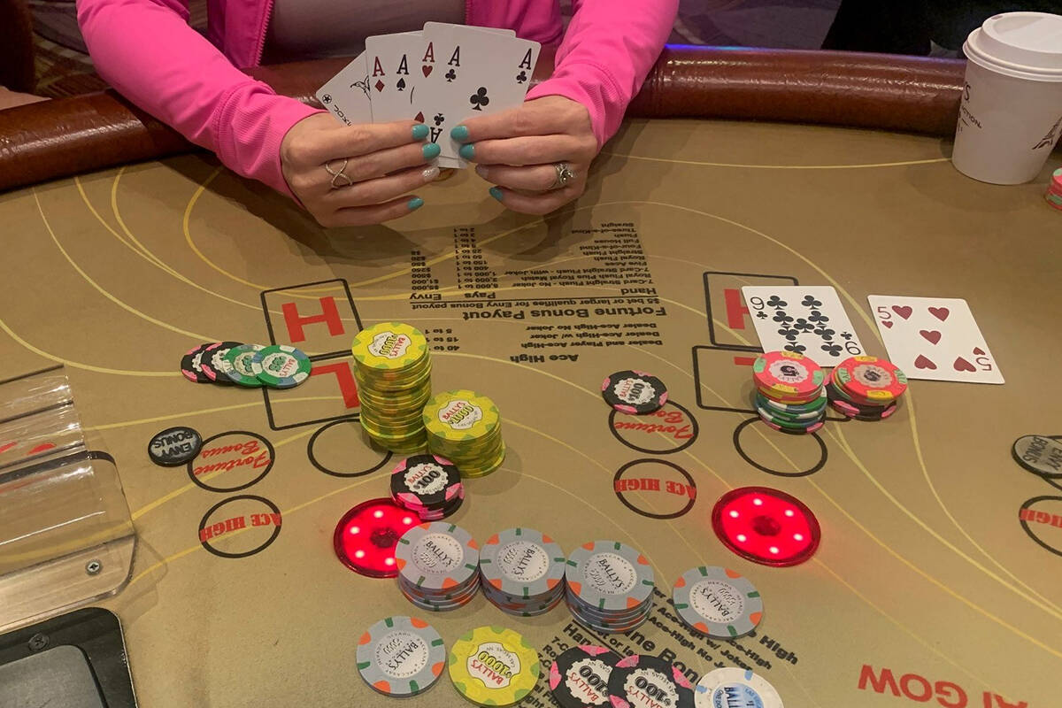 Rachel Hopper displays her winning pai gow hand, good for $113,423, on Wednesday, July 13, 2022 ...