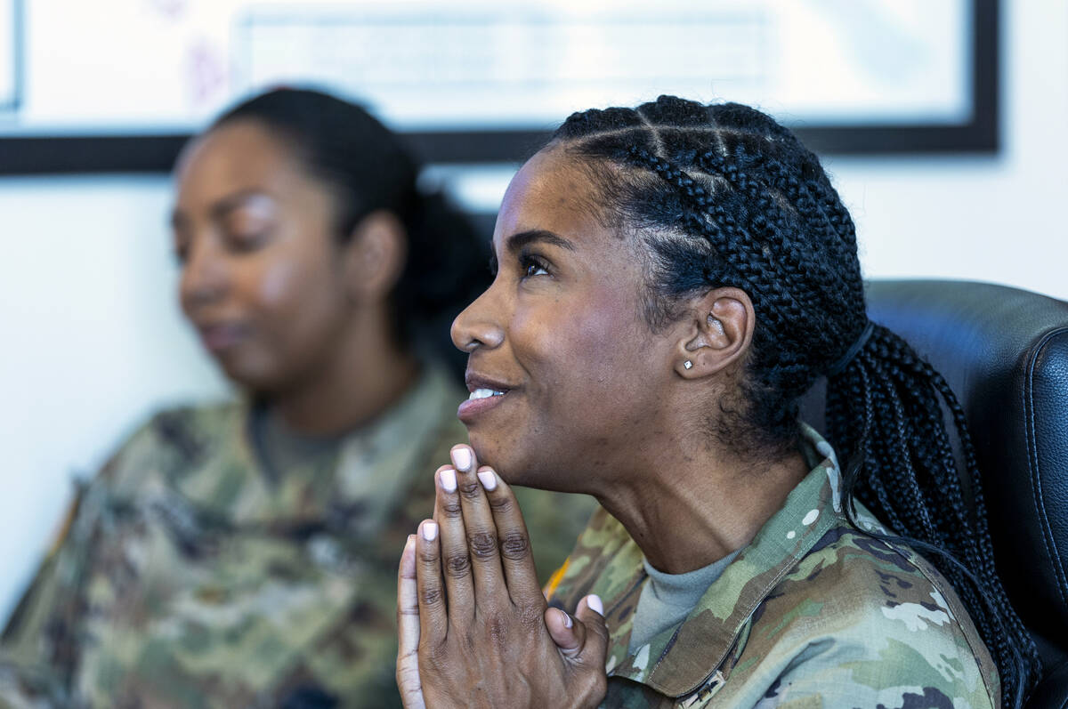 Lt. Col. Kourtney Logan, right, with Maj. Martina TaylorCampbell ponders a response about their ...