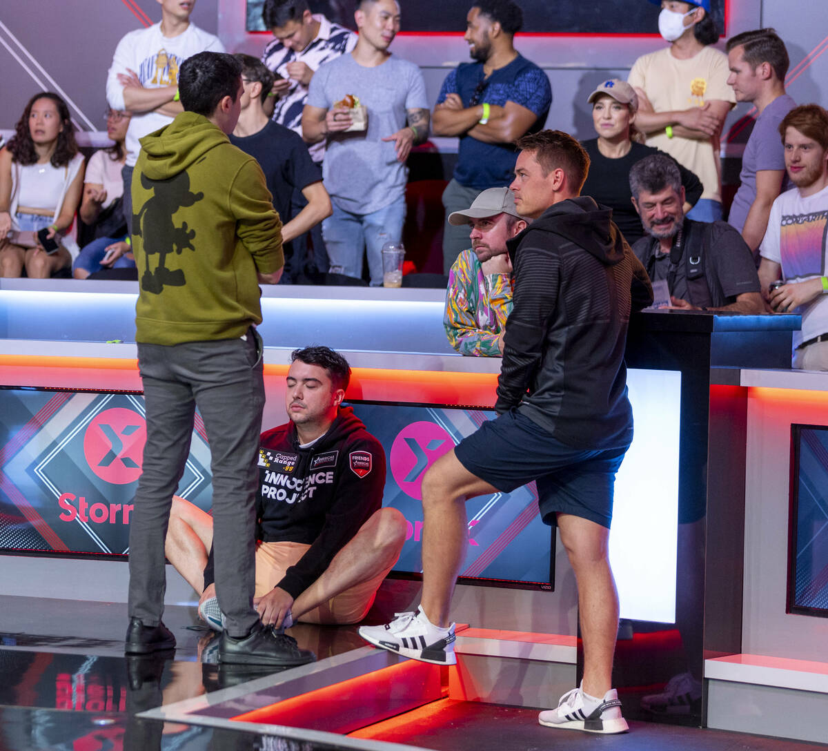 Players Michael Duek (left) and Espen Jorstad (right) chat while Asher Conniff meditates below ...