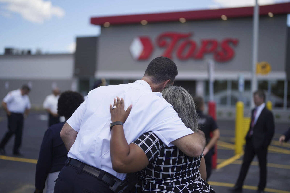 Buffalo Police Commissioner Joseph Gramaglia hugs Leah Holton-Pope, senior advisor to New York ...