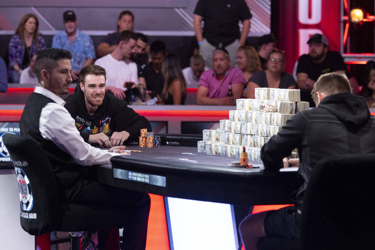 Adrian Attenborough, left, and Espen Jorstad, compete in the final table of the main event dur ...