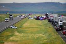 First responders work the scene on Interstate 90 after a fatal pileup where at least 20 vehicle ...