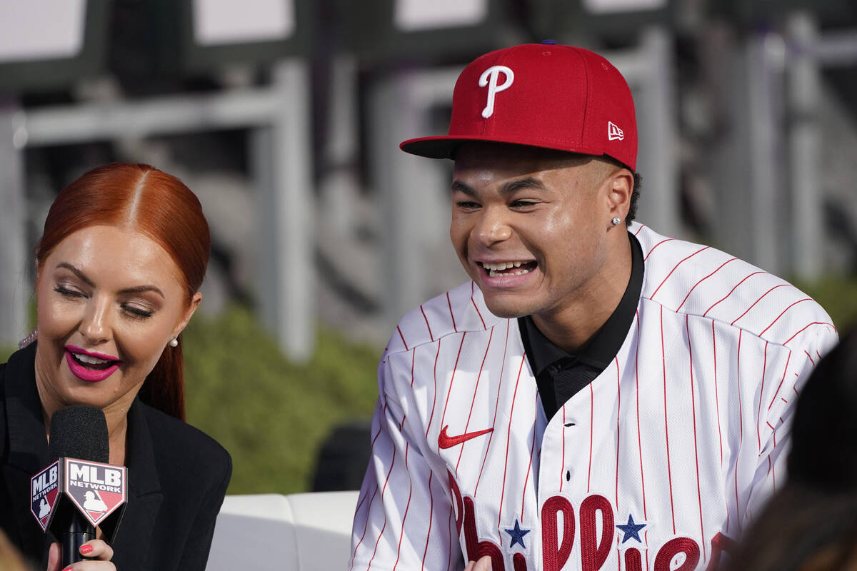 Justin Crawford, right, smiles after being selected by the Philadelphia Phillies with the 17th ...