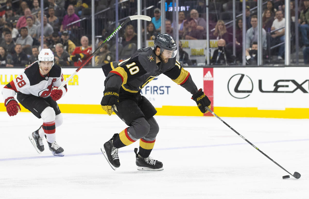 Golden Knights center Nicolas Roy (10) breaks away from New Jersey Devils defenseman Damon Seve ...