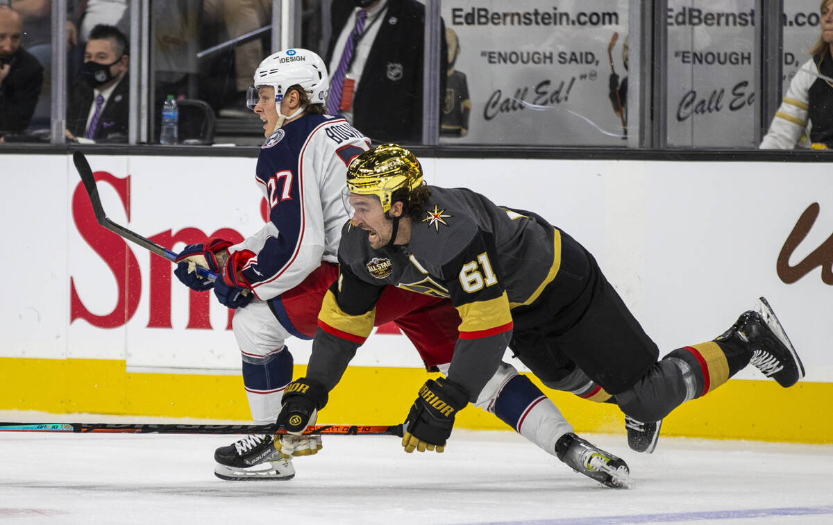 Columbus Blue Jackets defenseman Adam Boqvist (27) trips up Golden Knights right wing Mark Ston ...