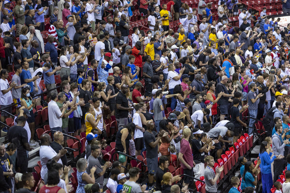 Fans stand an applaud during the first half of their NBA Summer League basketball game the Thom ...