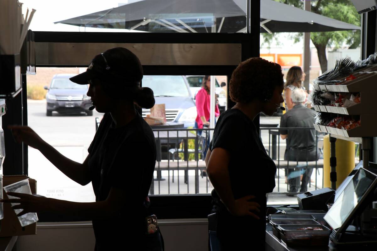 Taco Bell employees working inside the new Go Mobile location in North Las Vegas on Monday, Jul ...